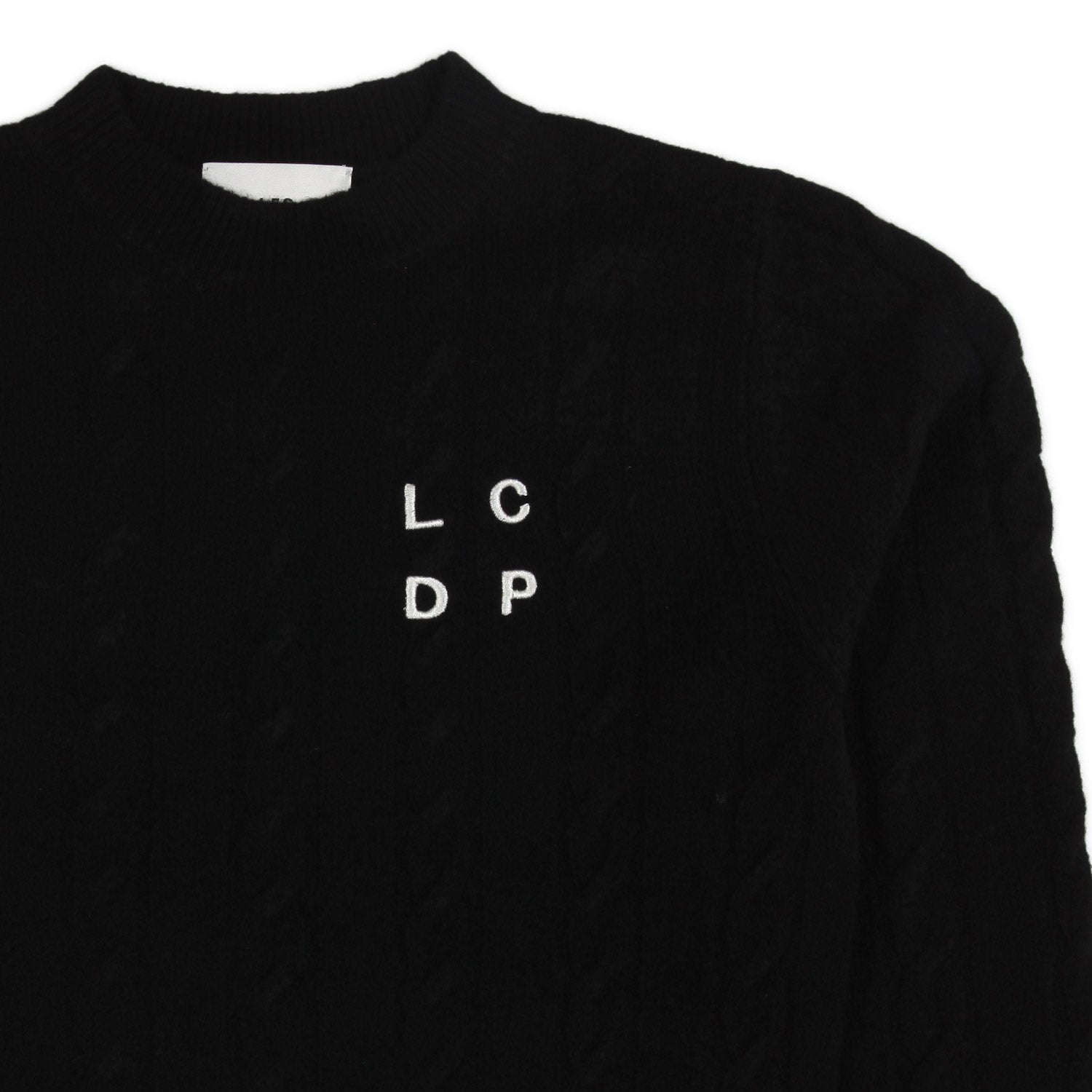 MAGLIONE NERO A TRECCE CON LOGO BIANCO - annameglio.com abbigliamento moda