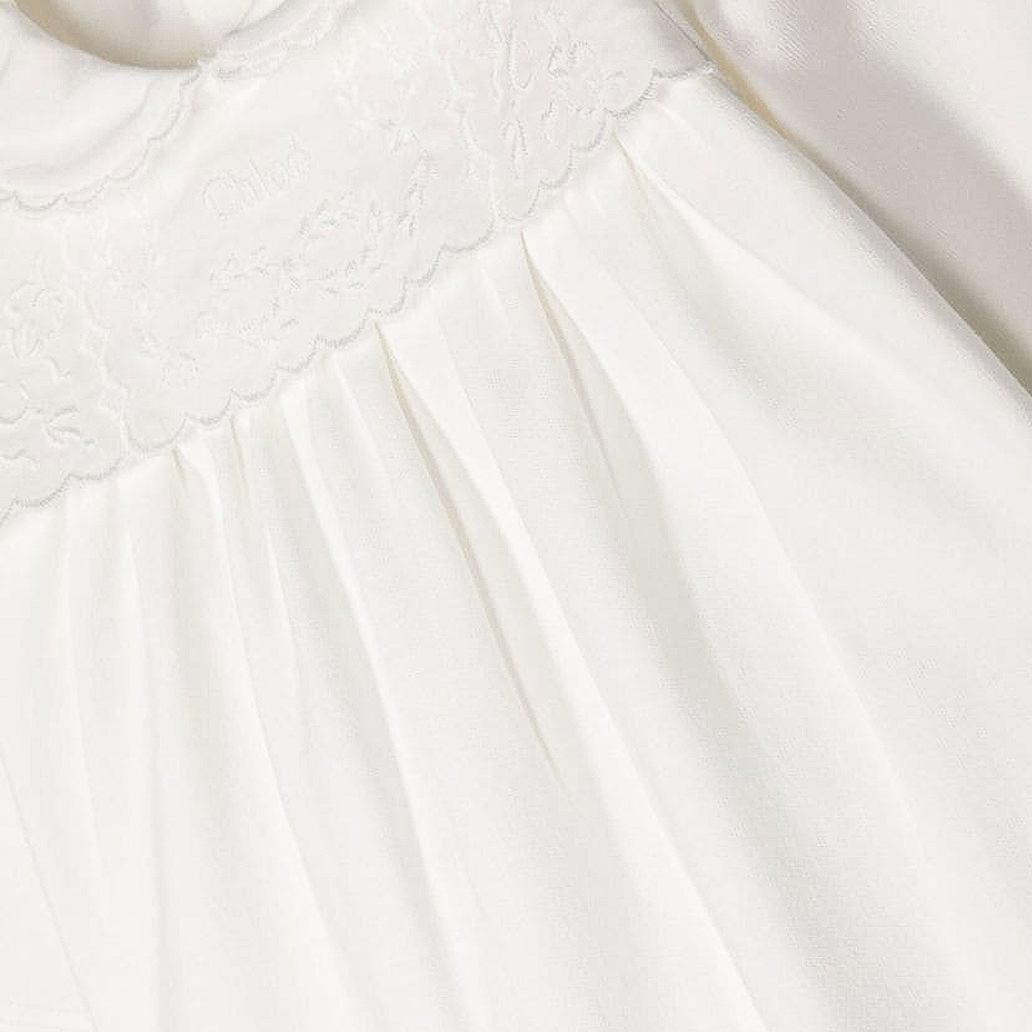 TUTINA BIANCA CON RICAMI NEONATA - annameglio.com abbigliamento moda