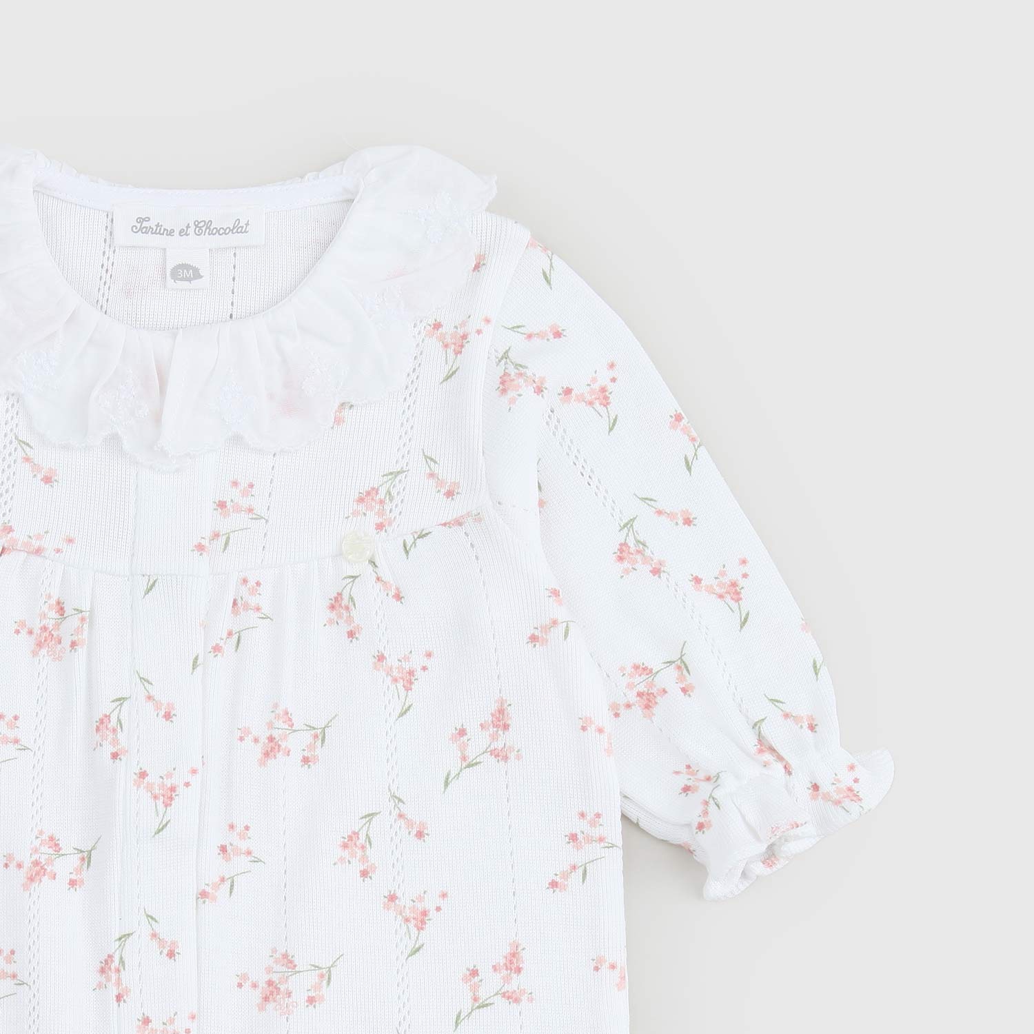 Tutina bianca per neonata con stampe a fiori - annameglio.com abbigliamento moda