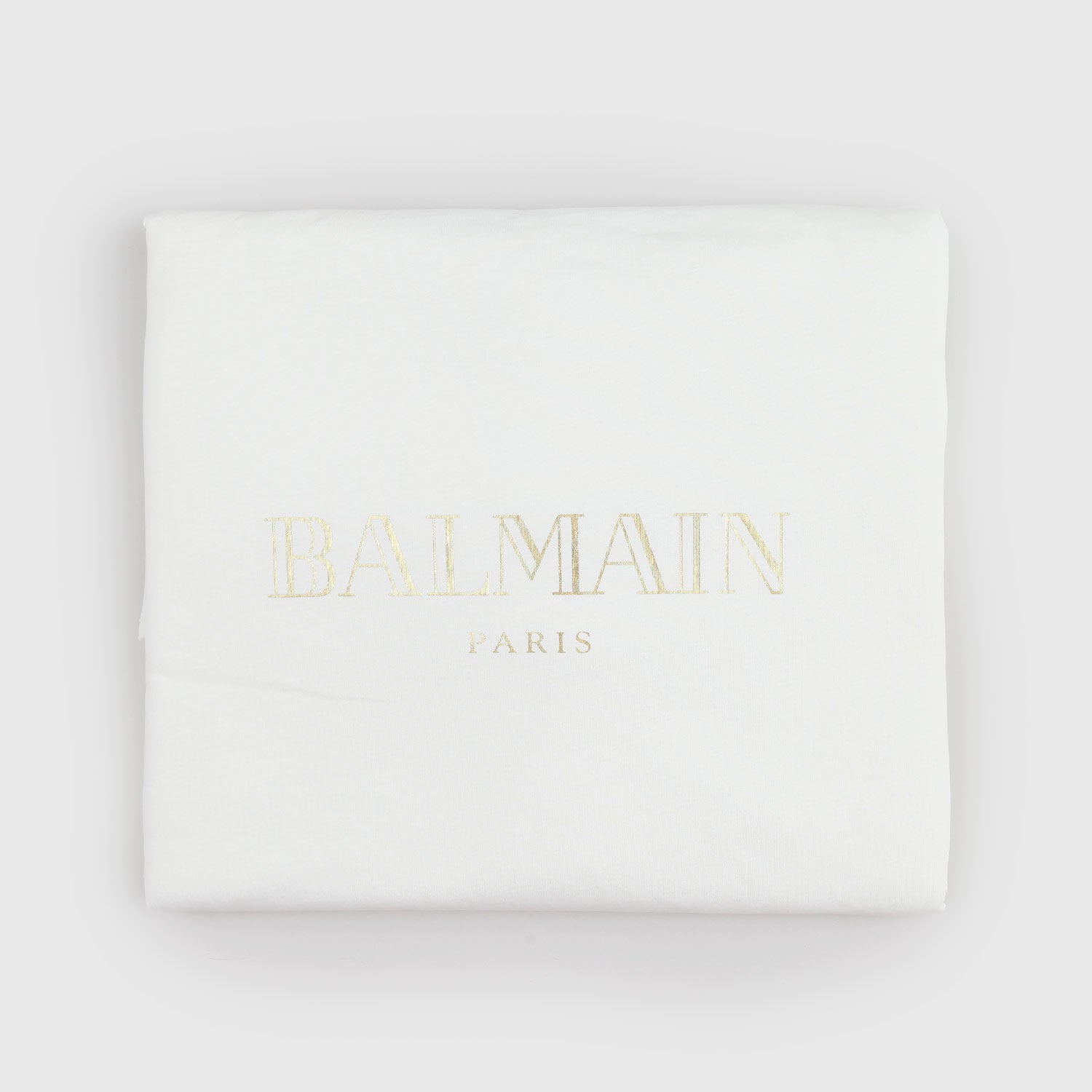 Coperta Balmain bianca con logo oro - annameglio.com abbigliamento moda