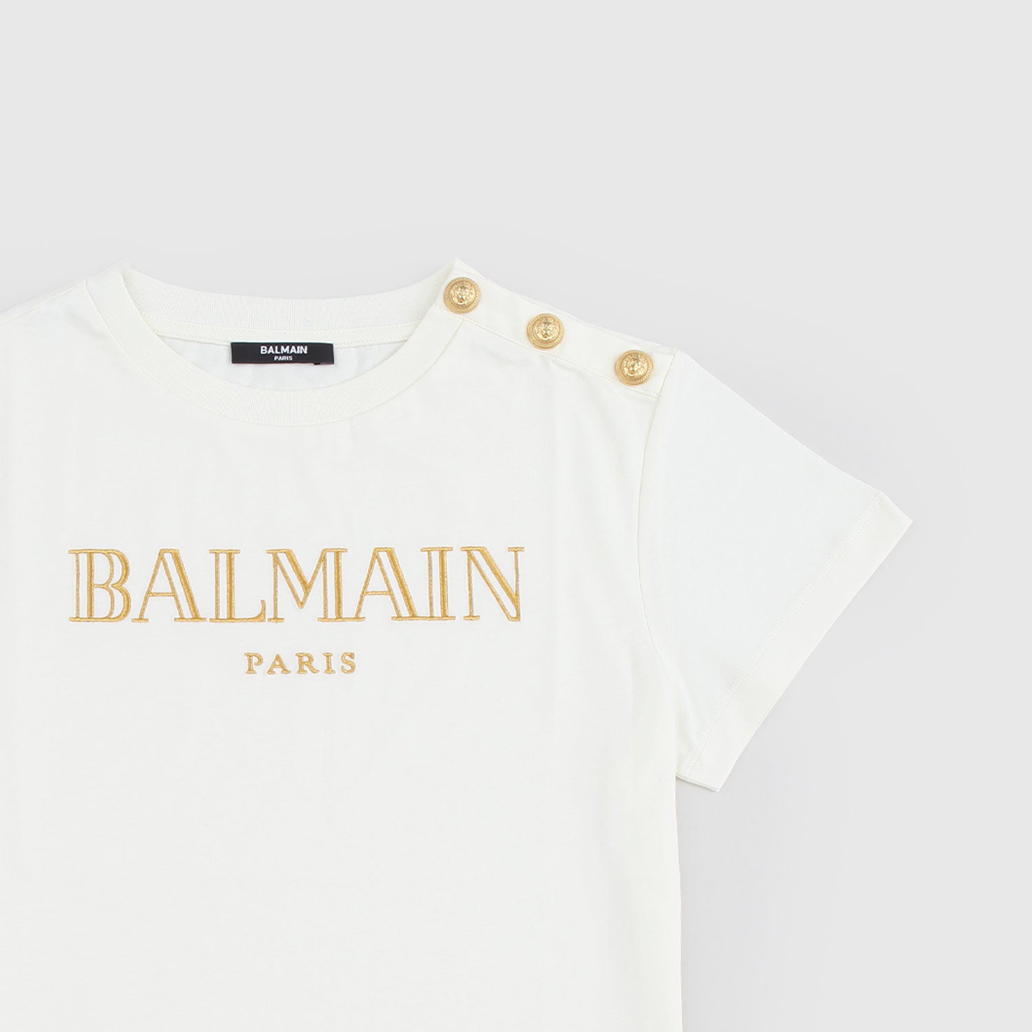 T-shirt beige con logo e bottoncini d’oro - annameglio.com abbigliamento moda