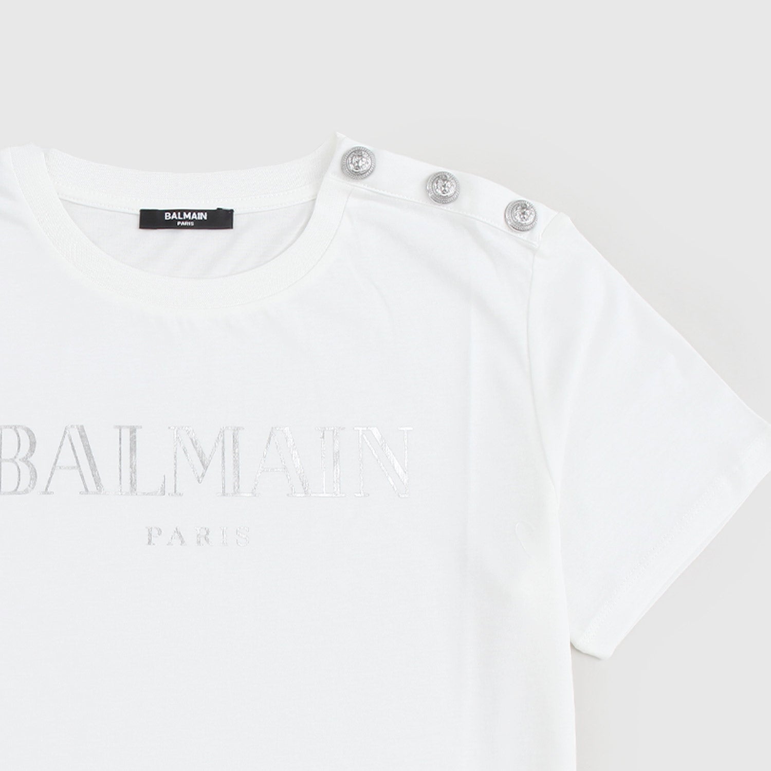 T-shirt bianca con logo e bottoni argento - annameglio.com abbigliamento moda