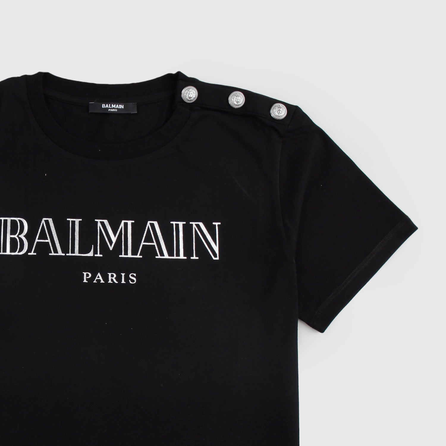 T-shirt Nera con logo e bottoni argento - annameglio.com abbigliamento moda