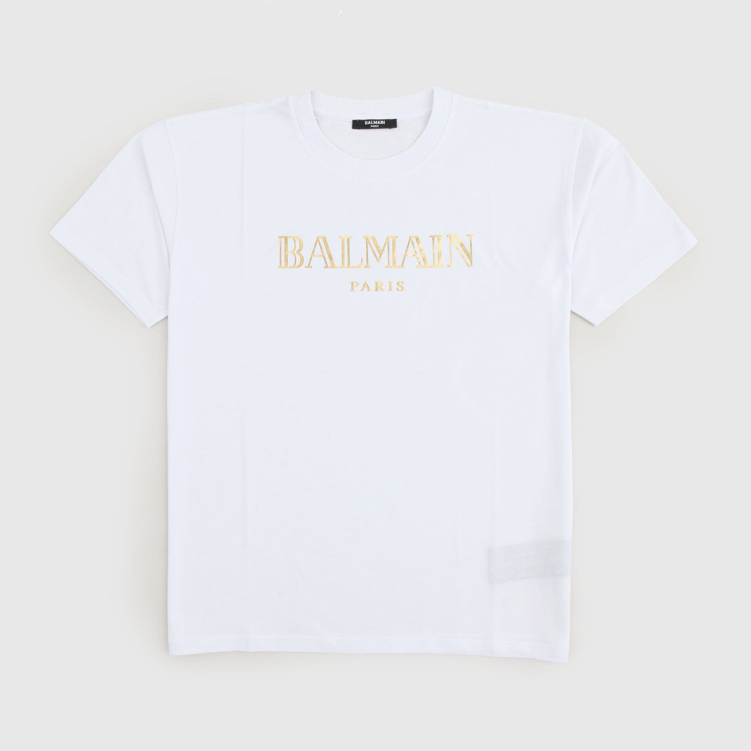 T-shirt Balmain bianca con logo d’oro - annameglio.com abbigliamento moda