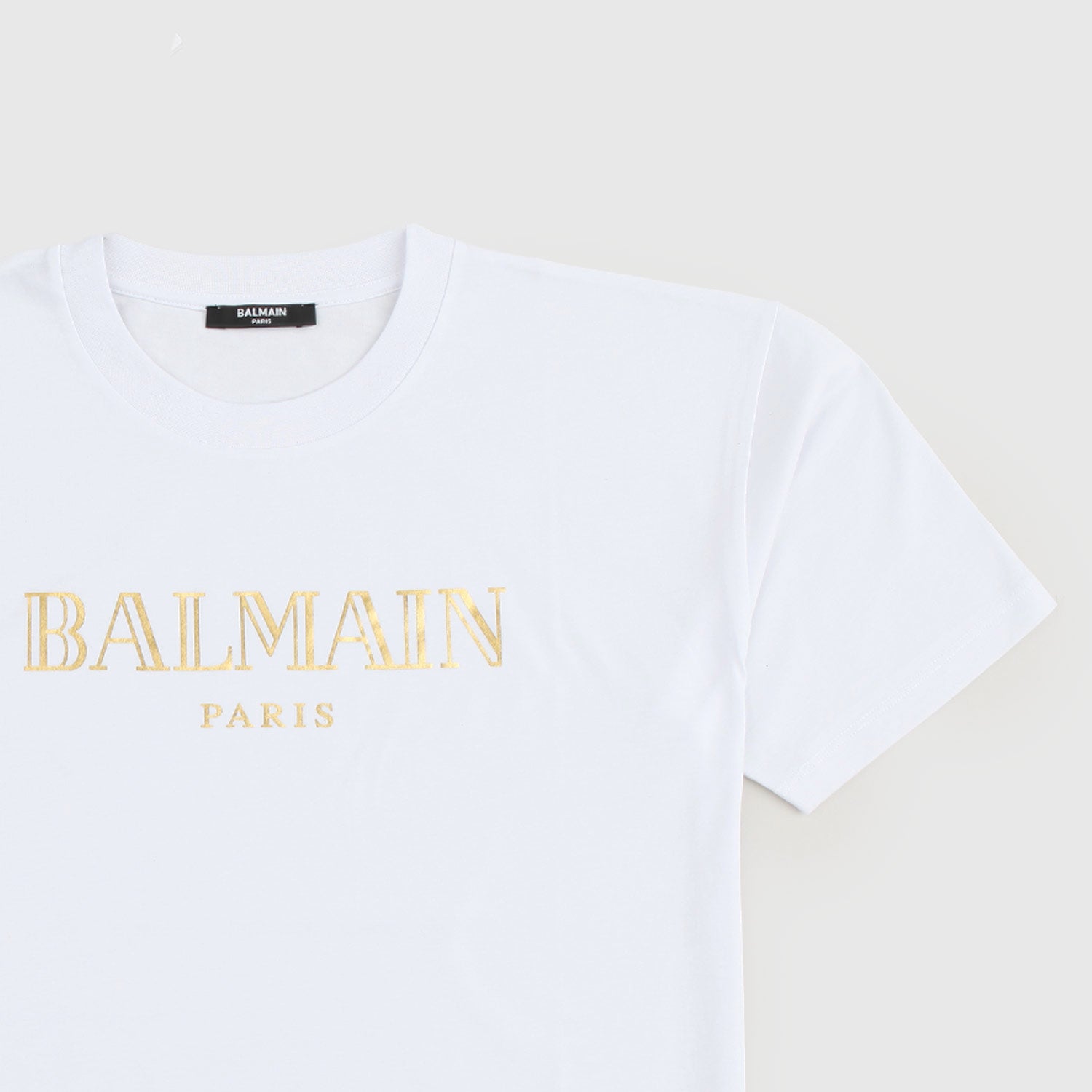T-shirt Balmain bianca con logo d’oro - annameglio.com abbigliamento moda