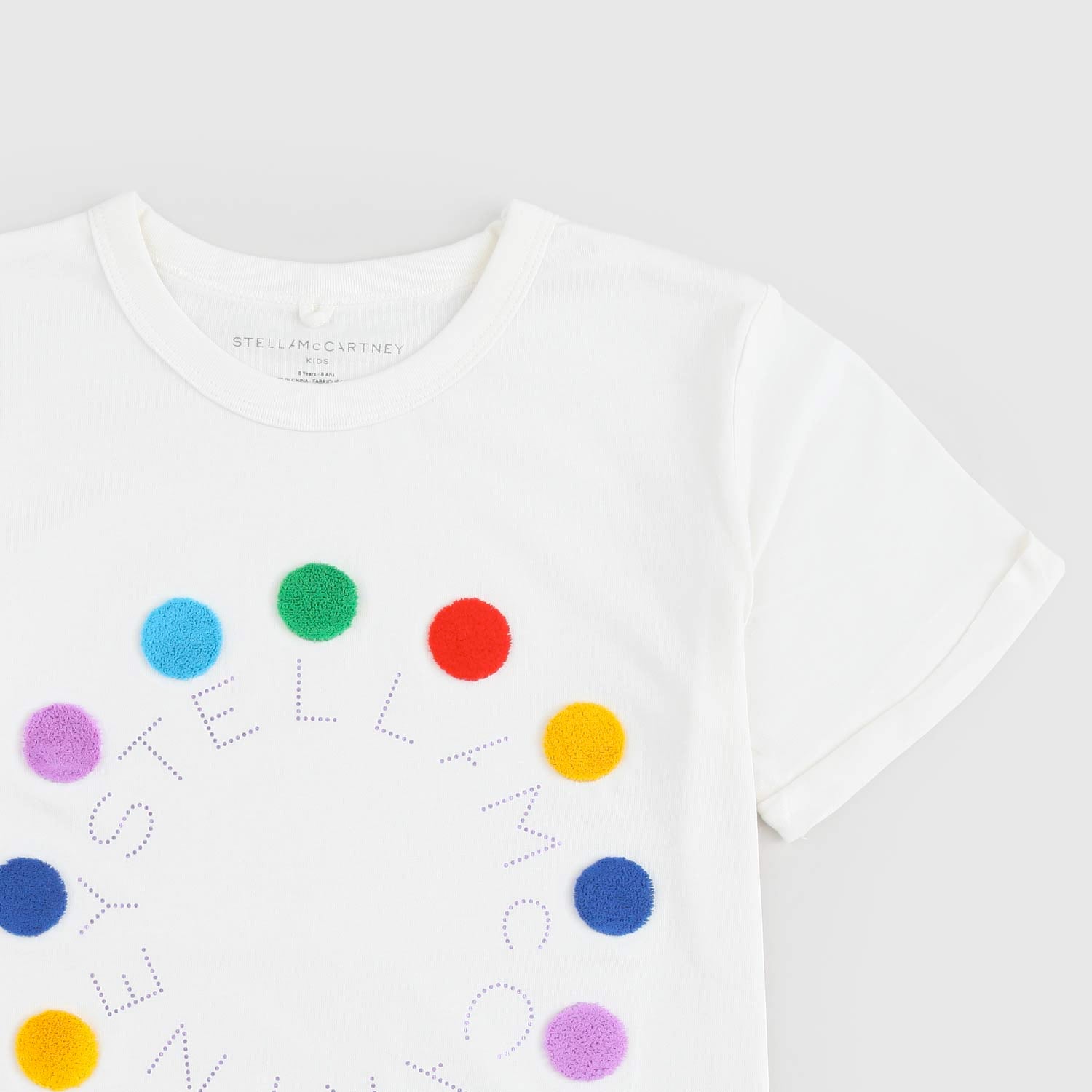 T-shirt bianca con logo e pois multicolor - annameglio.com abbigliamento moda