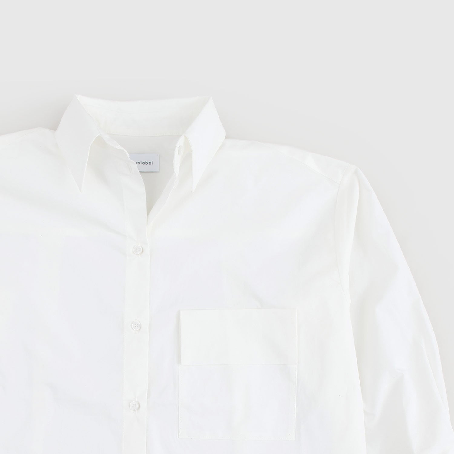 Camicia over bianca firmata UNLABEL - annameglio.com abbigliamento moda