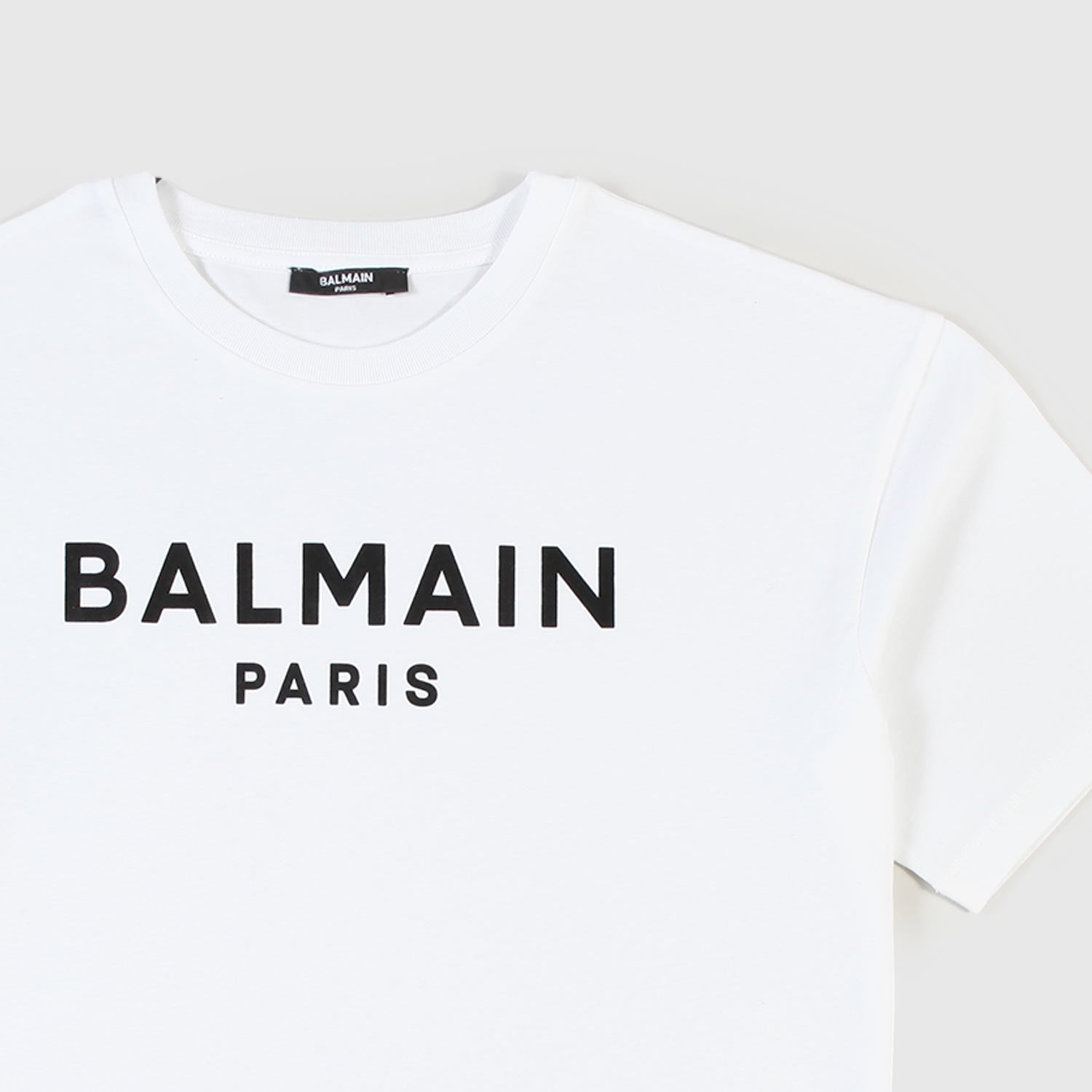 T-shirt Bianca Con Logo Lettering Firmata BALMAIN - annameglio.com abbigliamento moda