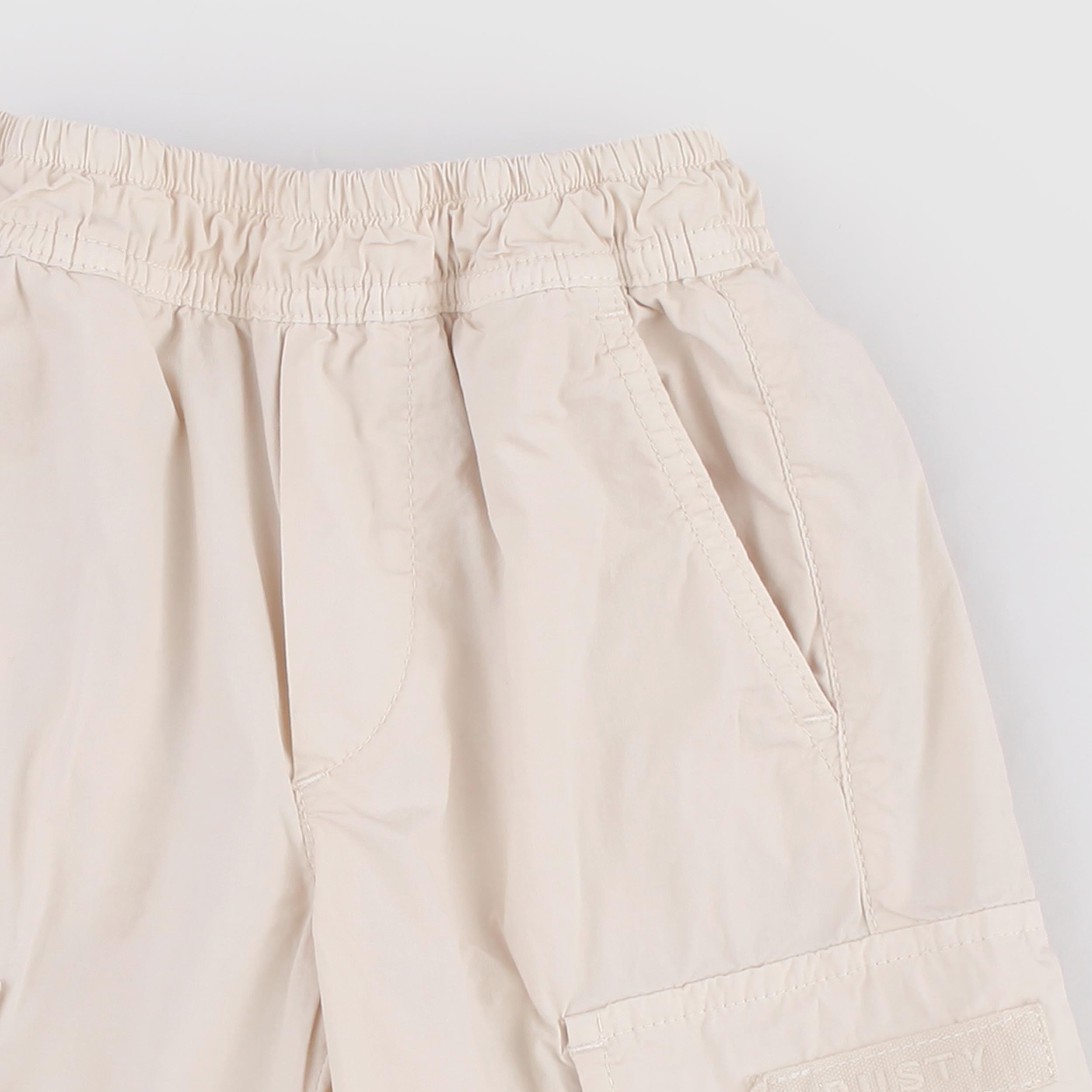 Beige Bermuda Shorts with Oblique Pockets by DUSTY COLOR