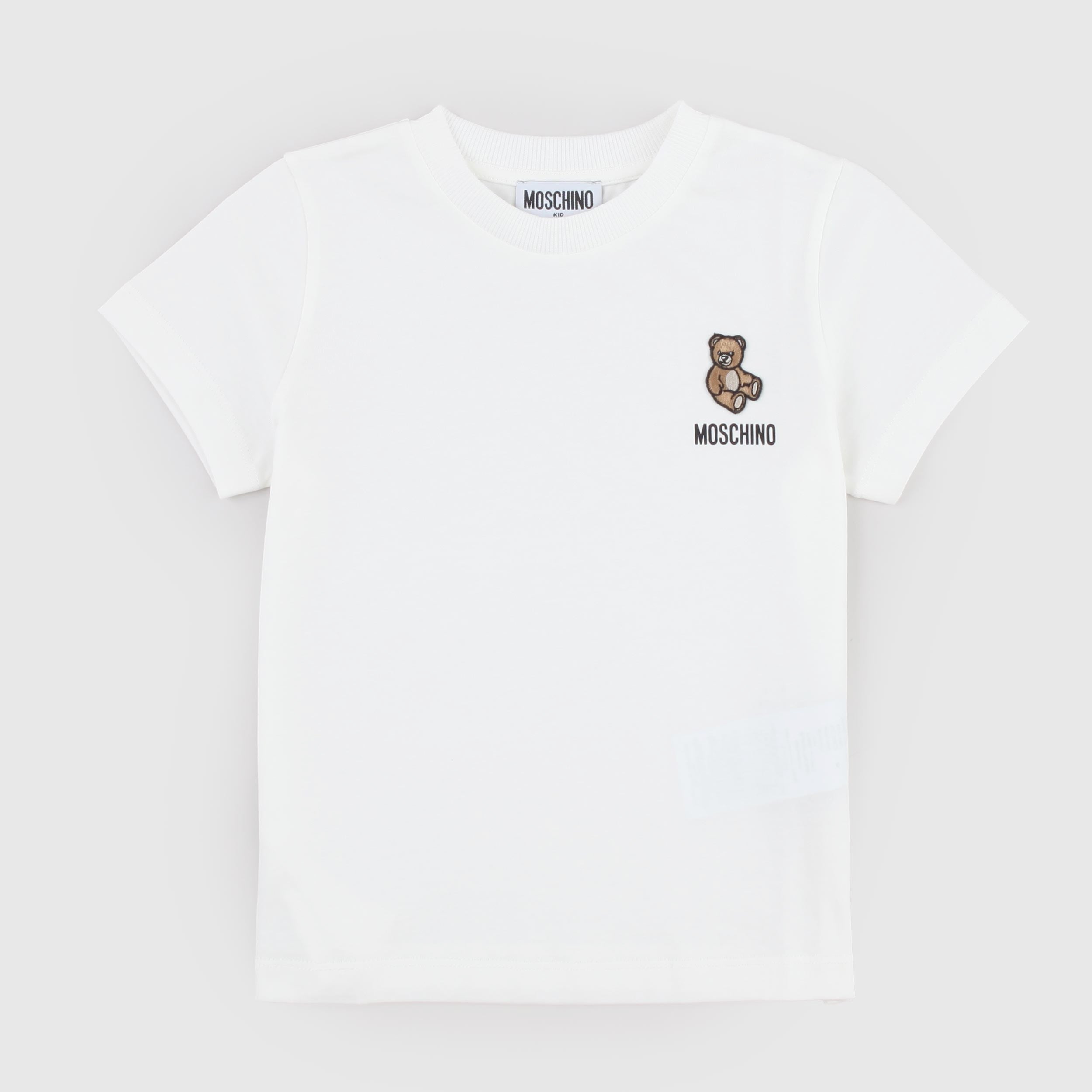 White T-shirt with a MOSCHINO tag on the left side