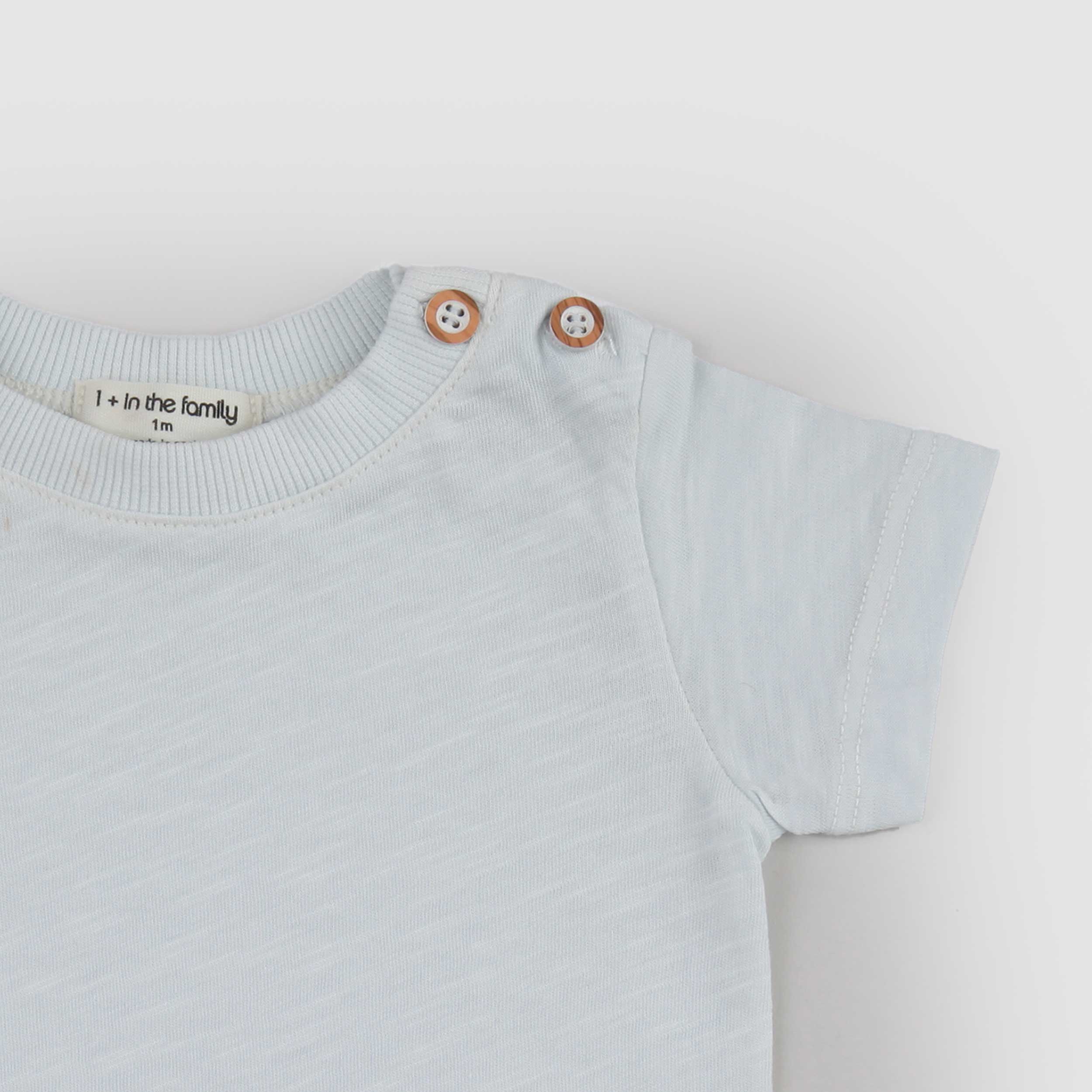 T-shirt Celeste con Bottoni Firmata ONE MORE IN THE FAMILY
