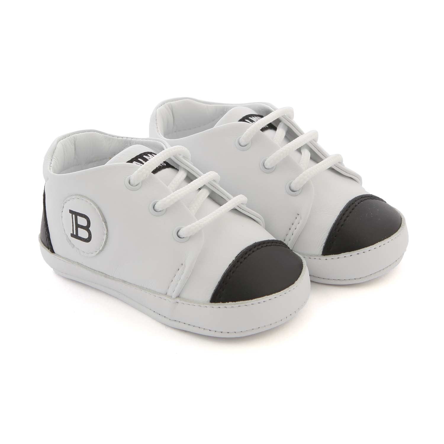 MINI SNEAKERS BIANCHE E NERE IN PELLE NEONATA - annameglio.com abbigliamento moda