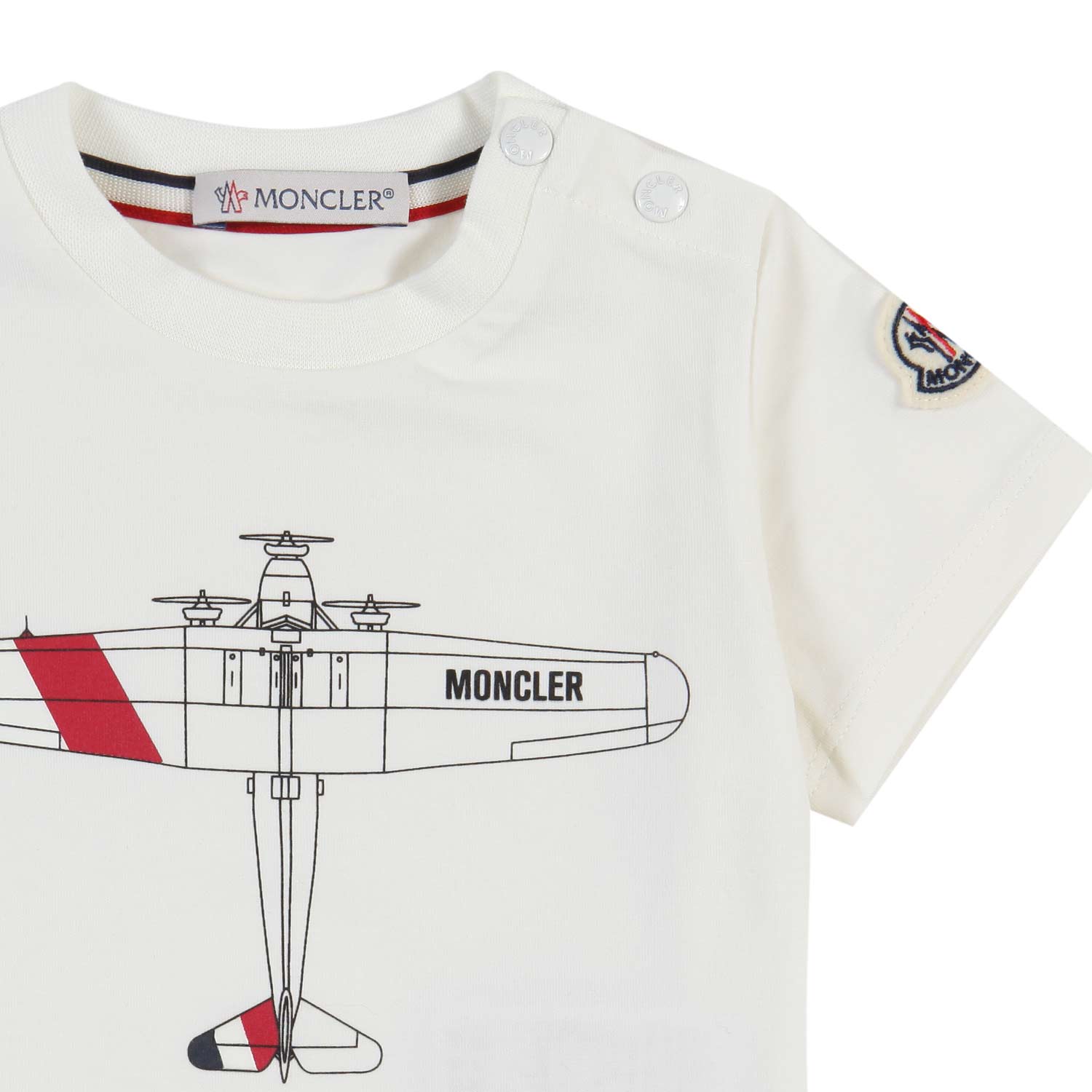 T-shirt Moncler bianca con stampa aeroplano Bimbo - annameglio.com abbigliamento moda