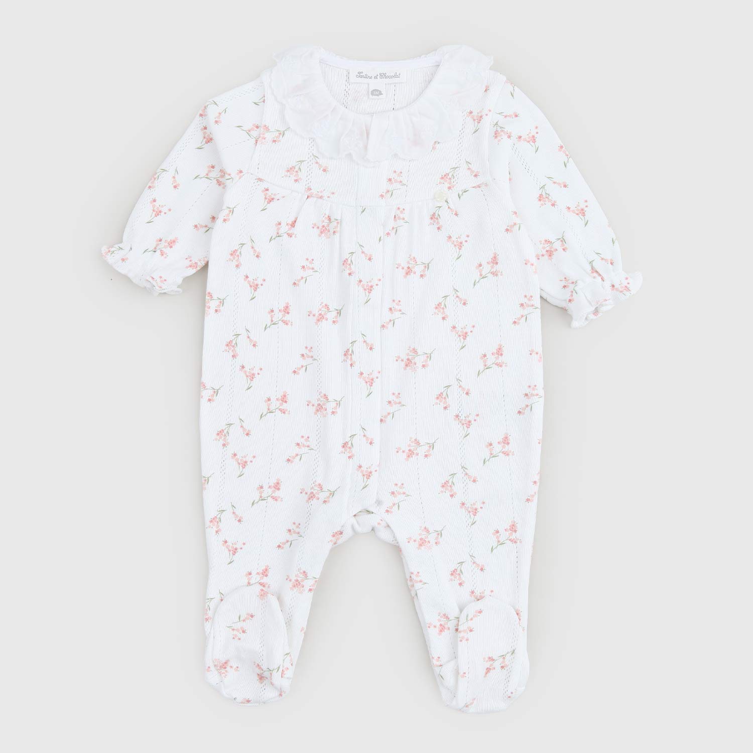 Tutina bianca per neonata con stampe a fiori - annameglio.com abbigliamento moda