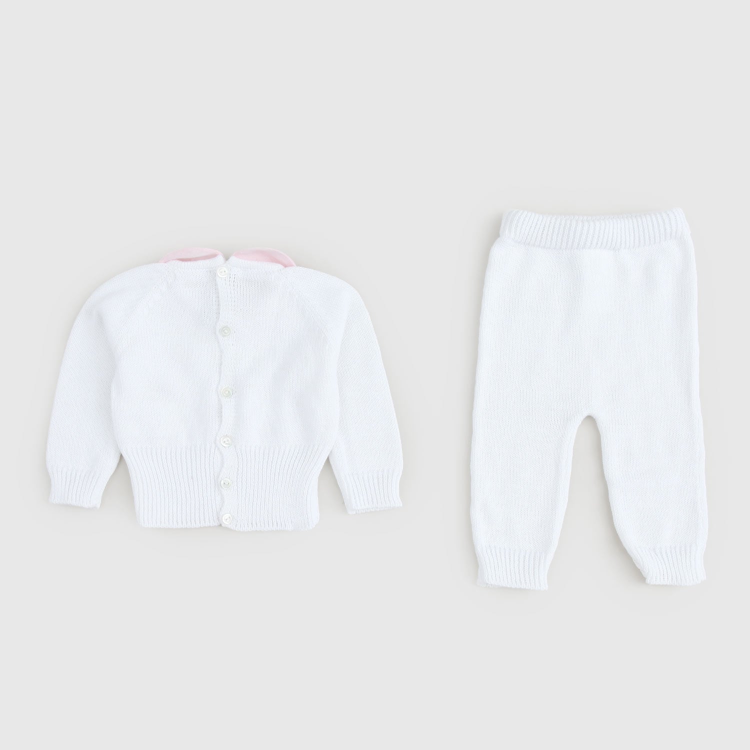 Completino bianco con ricamo a fiori - annameglio.com abbigliamento moda