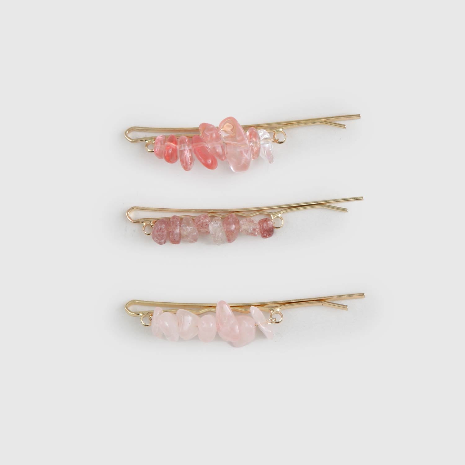 Tris fermagli con pietre rosa - annameglio.com abbigliamento moda