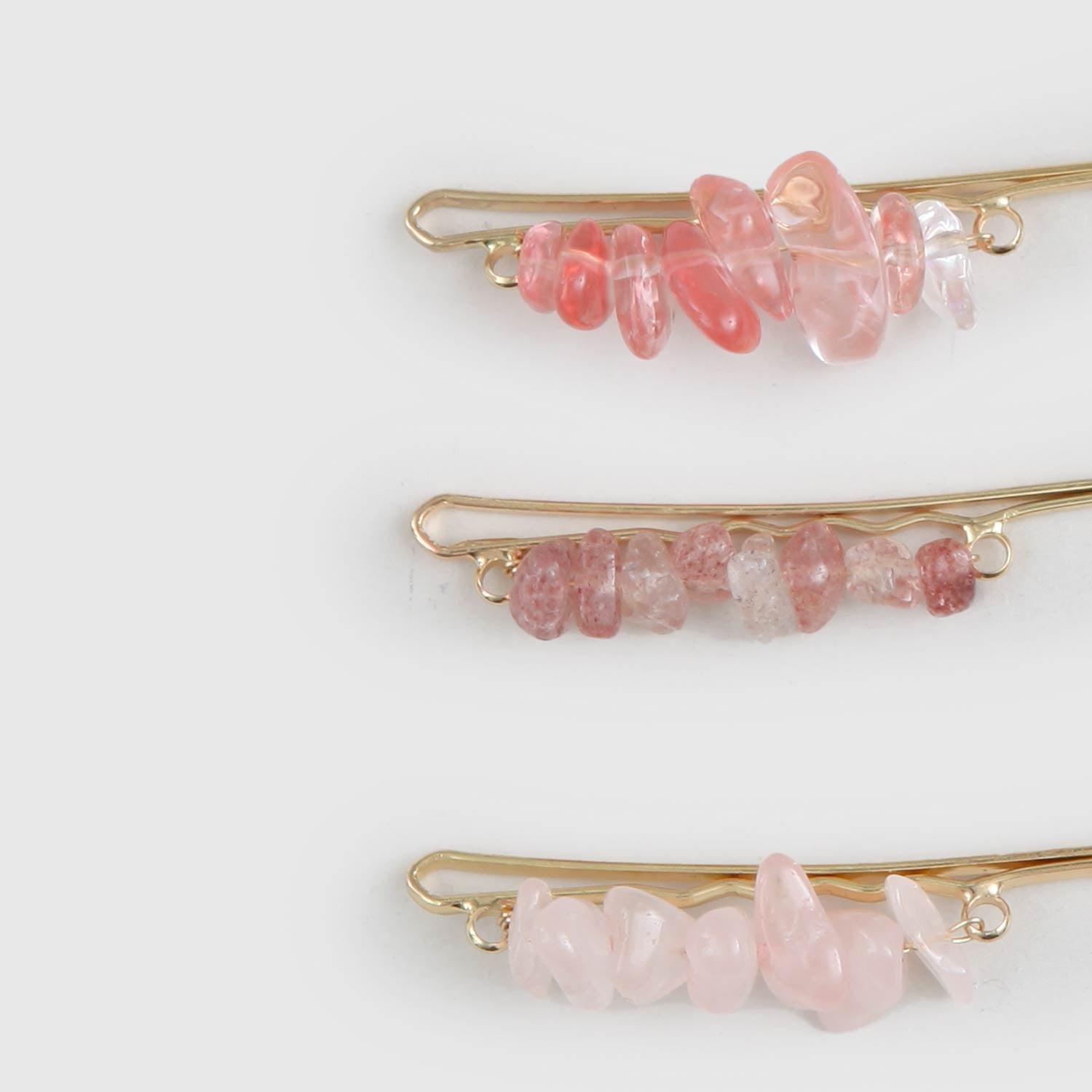 Tris fermagli con pietre rosa - annameglio.com abbigliamento moda