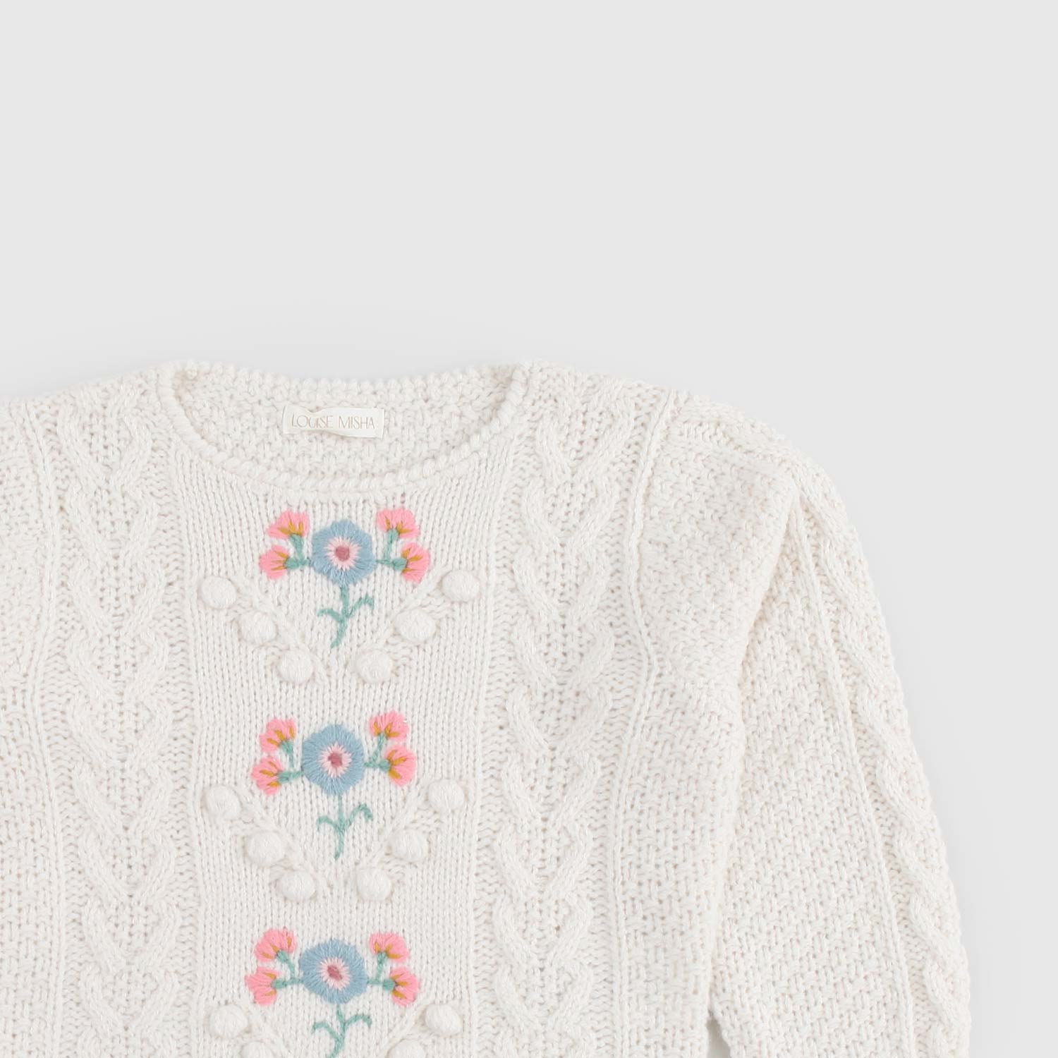 Maglione bianco e motivi ricamati floreale - annameglio.com abbigliamento moda