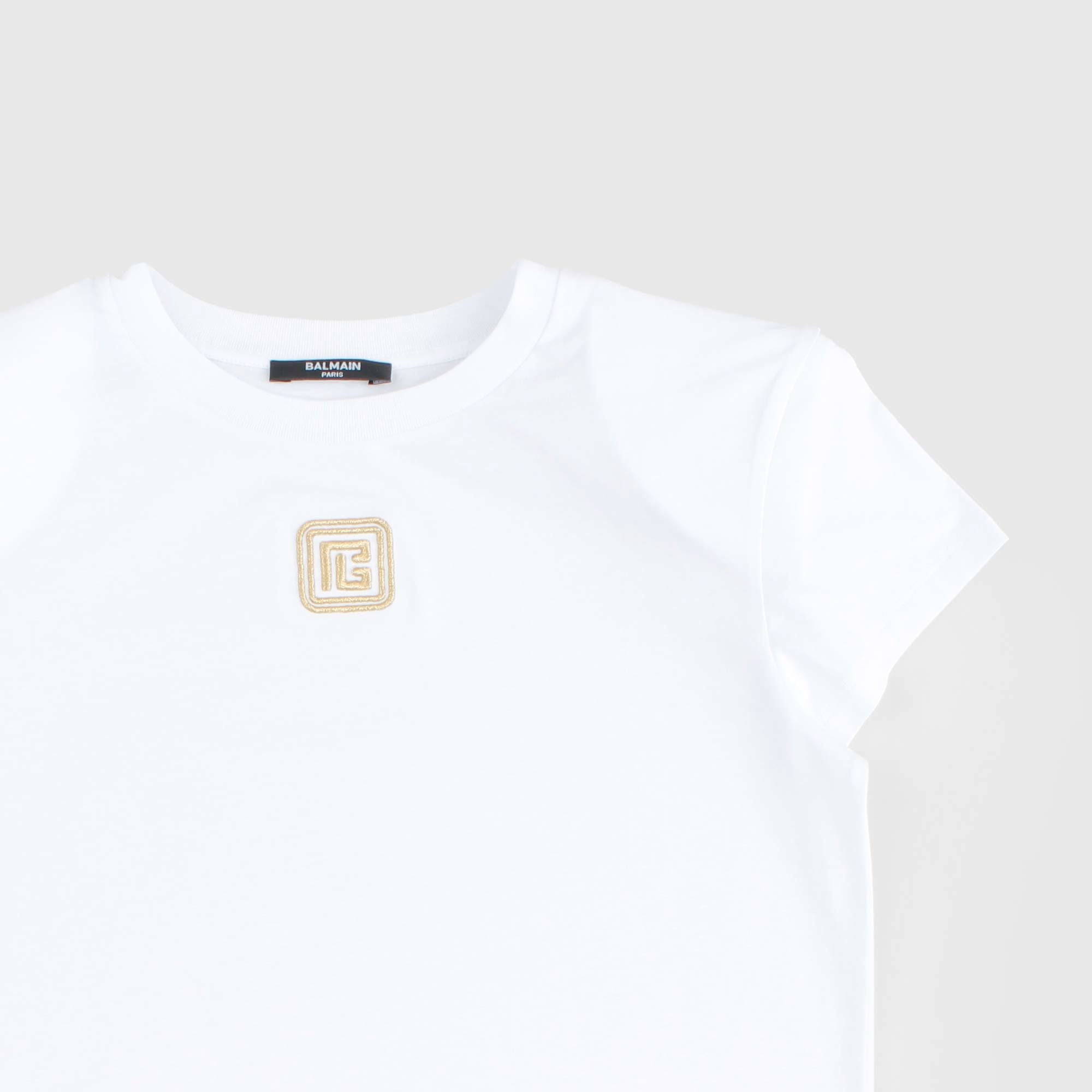 T-shirt Bianca Con Logo Oro Firmata BALMAIN - annameglio.com abbigliamento moda