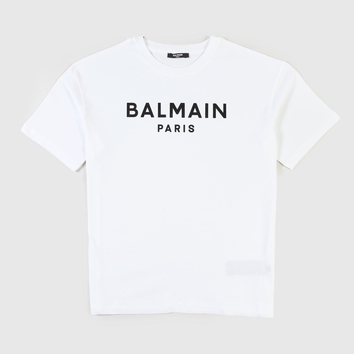 T-shirt Bianca Con Logo Lettering Firmata BALMAIN - annameglio.com abbigliamento moda