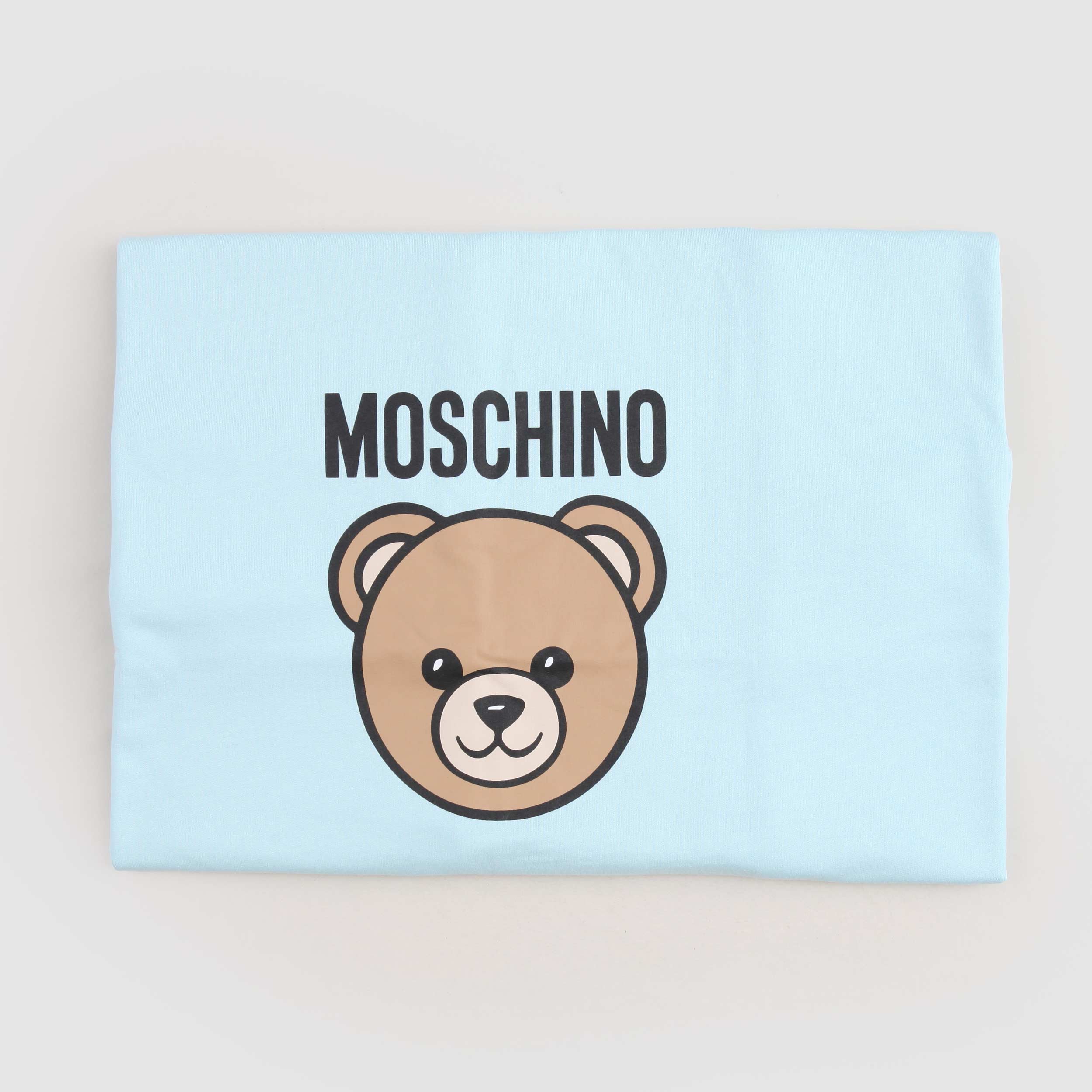 Copertina Azzurra Con Stampa Logo Firmata MOSCHINO - annameglio.com abbigliamento moda