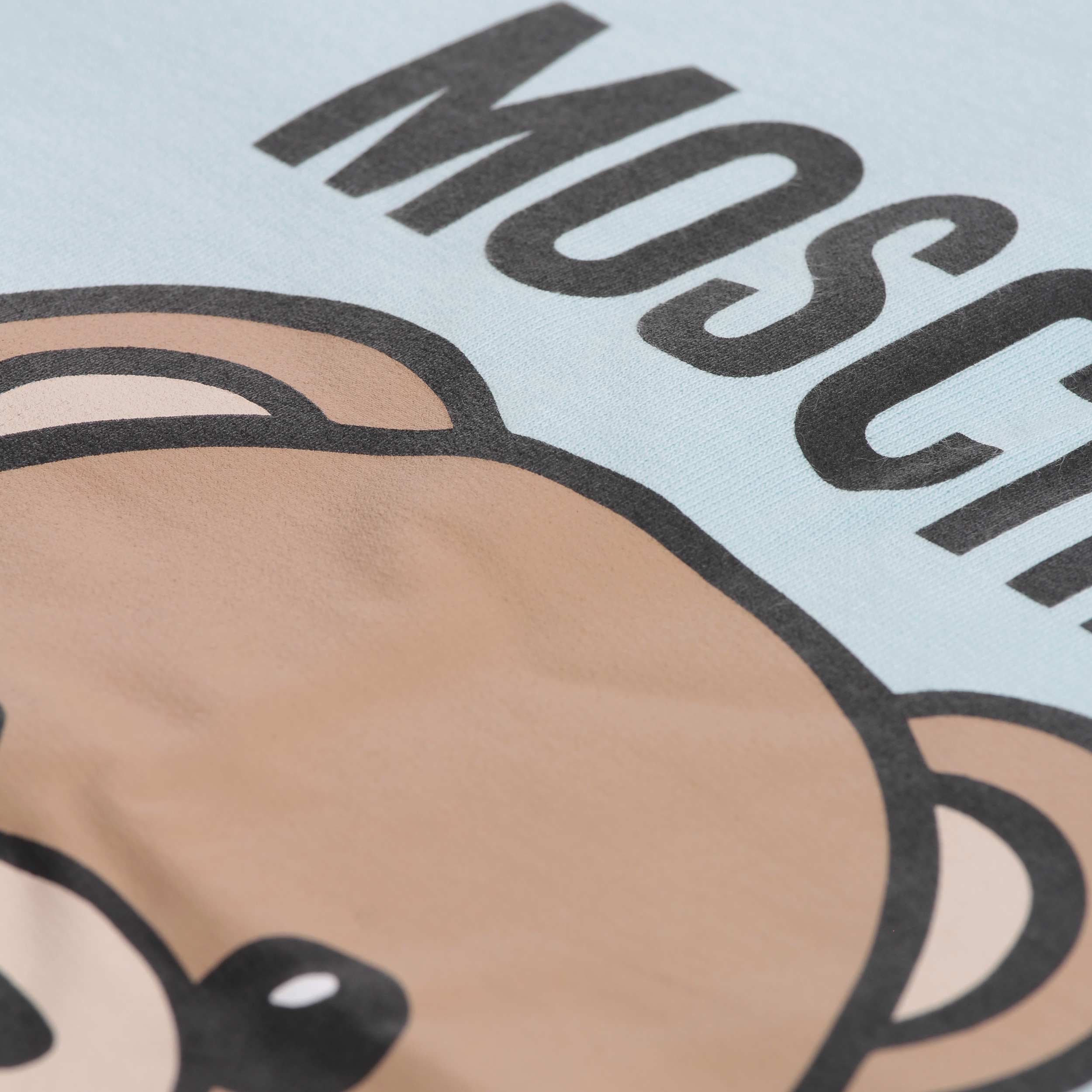 Copertina Azzurra Con Stampa Logo Firmata MOSCHINO - annameglio.com abbigliamento moda