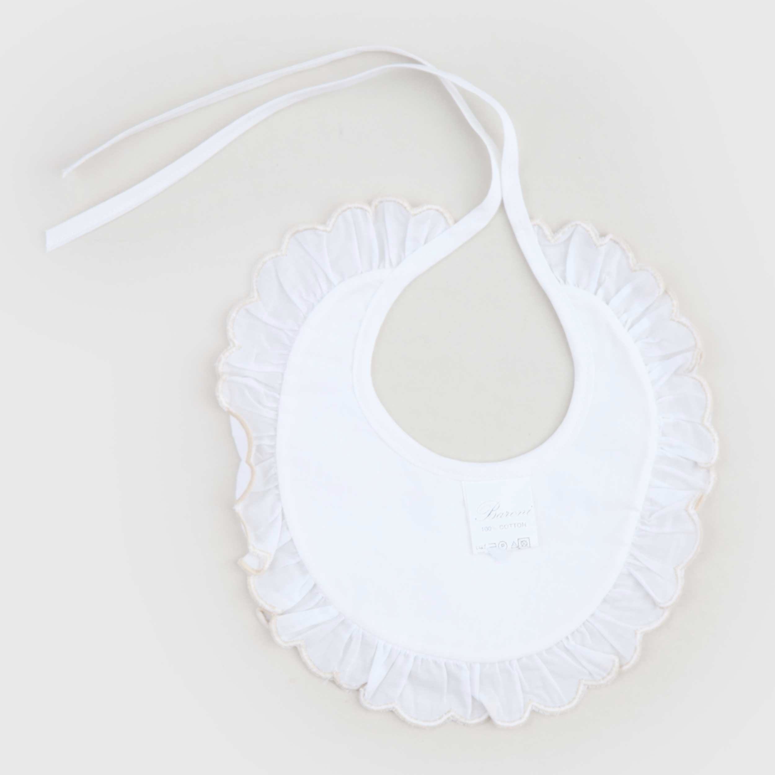 White bib with embroidery signed BARONI