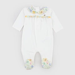 Milk-colored romper with patterned details by COCCODE