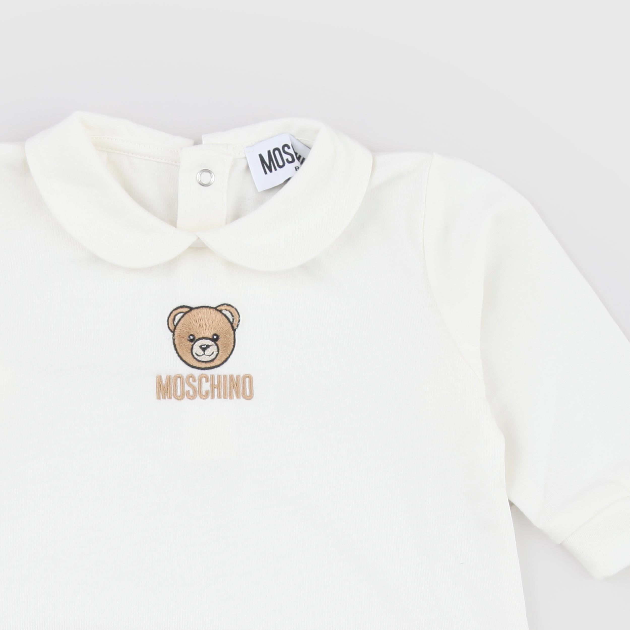 Tutina Bianca Stemma Iconico a Contrasto Firmata MOSCHINO