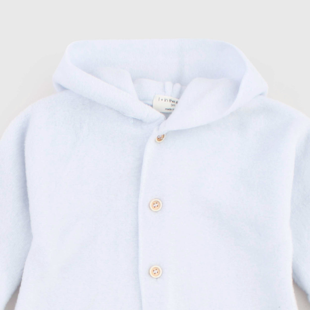 Light blue Baby Footed onesie by ONE MORE IN THE FAMILY