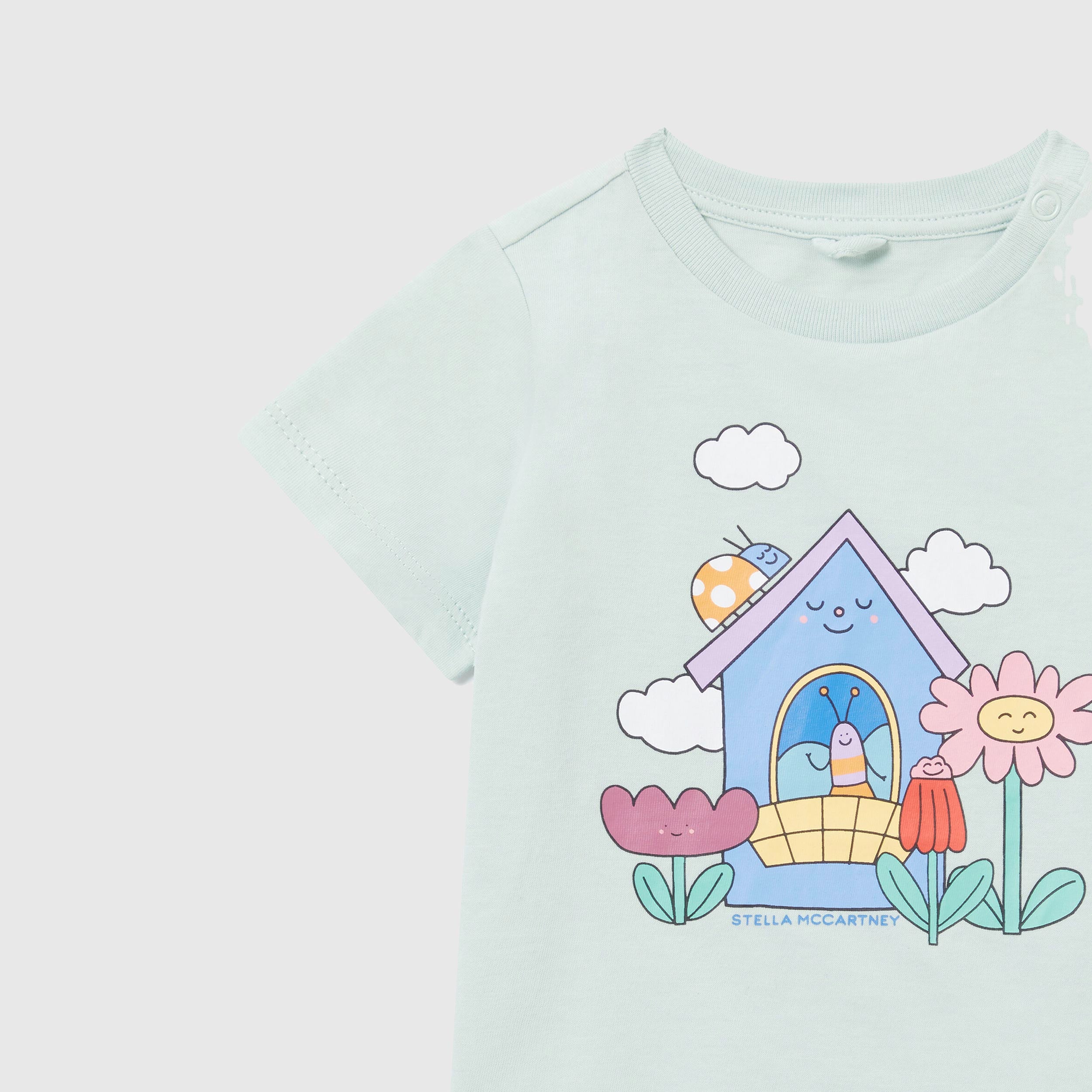 Green T-shirt with buttons on the shoulders by STELLA MCCARTNEY